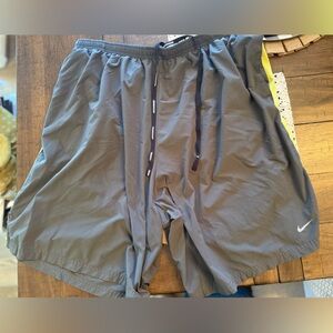 Nike Men's Gray Athletic Shorts with Yellow Trim